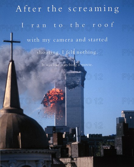 Colour photograph showing the burning World Trade Centre buildings with Church dome in the foreground