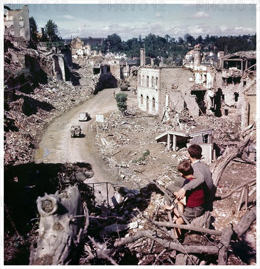 Photograph of French boys observing Allied vehicles 1944