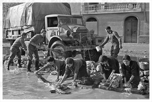 Photograph of World War Two New Zealand Soldiers clearing a truck