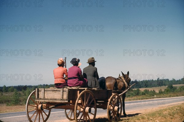 African American family travelling to town on a Saturday afternoon