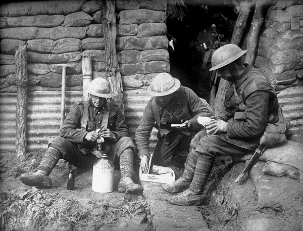 Canadian soldiers resting in a trench