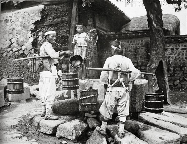 Water carrier visits a village