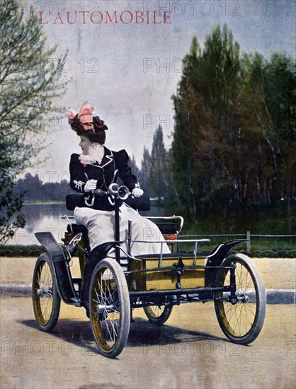 An 1899 Decauville Voiturelle motorcar driven by a woman
