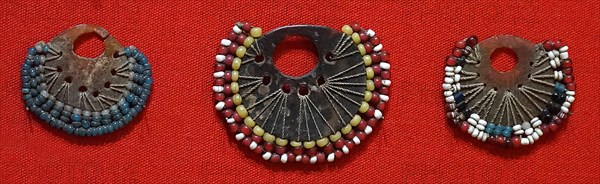 Tortoise-shell earrings from Papua New Guinea, with glass beads traded from Europe, Circa 1900