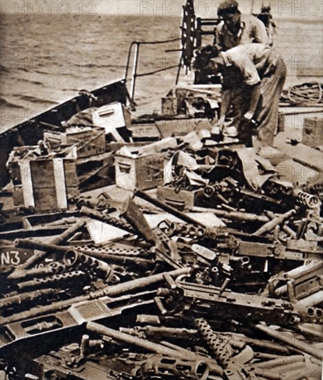 Photograph of obsolete British military stores being dumped into the sea