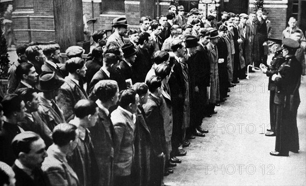 English conscripts in front of a recruitment centre in the months before world war Two 1939