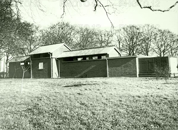 Photograph of a building housing a horizontal solar tower as part of the Cambridge University observatories