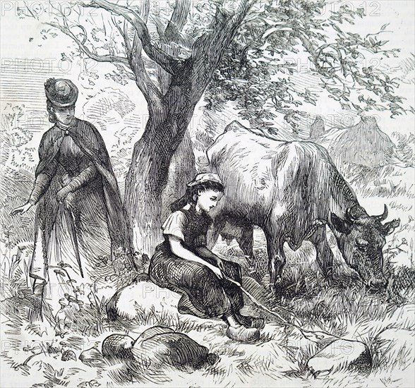 A cow girl in Vosges, a range of low mountains in Eastern France