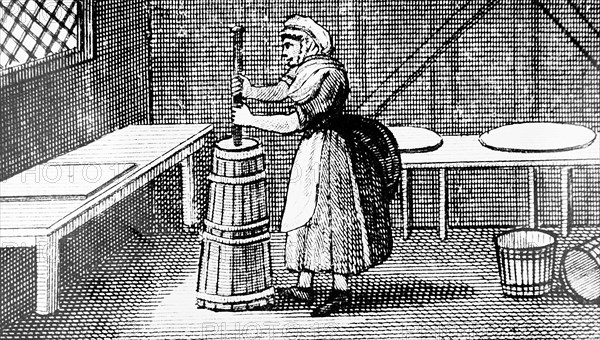 A dairy and dairymaid using a piston churn