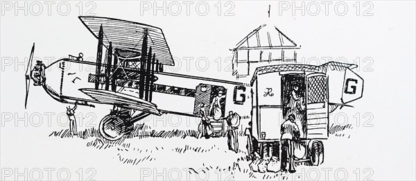 A Biplane being loaded with mail