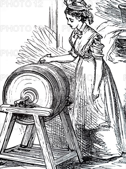 A butter maid churning butter