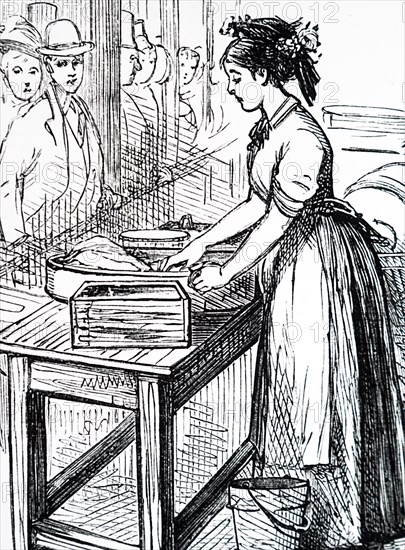 A butter maid making butter