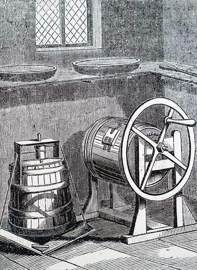 A vertical treadle butter churn