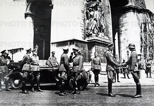 Photograph of German officers at Place Etoile, beneath the arc de Triomphe, Paris; during the German occupation of France 1940
