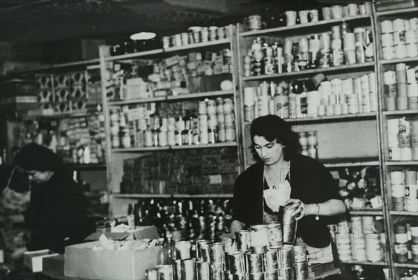 Photograph taken inside a depot used for canning food and milk in Paris, during the German occupation of France