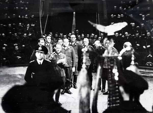 Photograph of Nazi soldiers singing at the start of a circus in Paris, during the German occupation of France, in World War Two