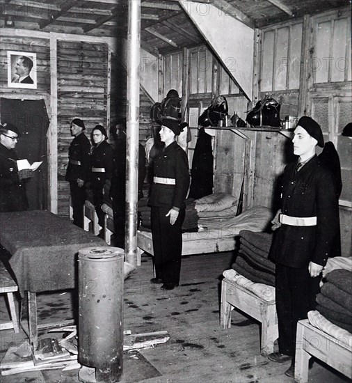 Photograph of French soldiers praying in their barracks in occupied France during World War Two