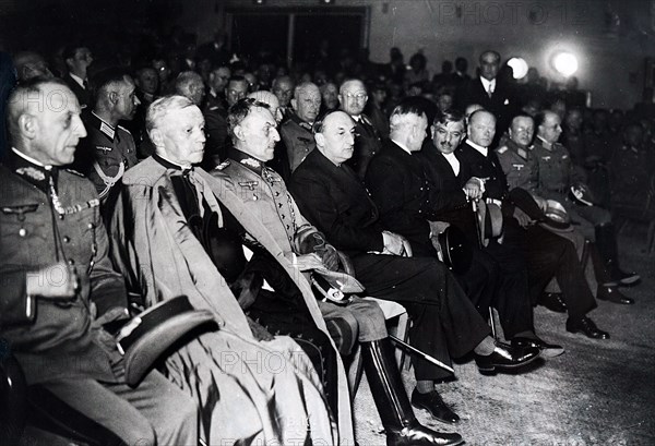 Photograph of Nazi leaders gathered with French leaders for an evening event in Paris