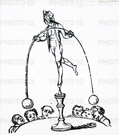 A circus performer balancing atop a podium
