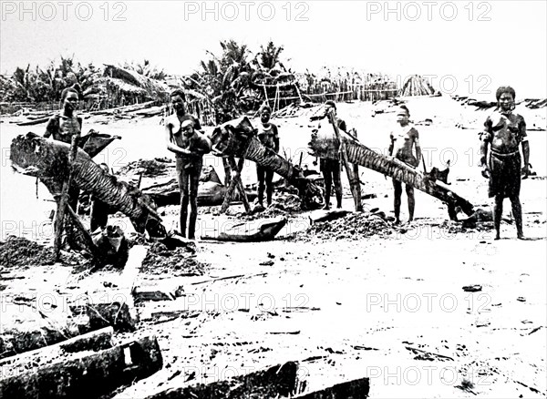 Photograph of New Guinea villagers preparing to go fishing