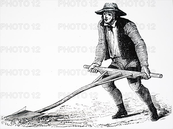 A farmer using a mollebart, or a levelling spade