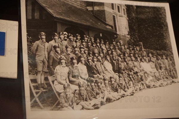 Photograph of school boys and teachers wearing gas masks during the Second World War in England