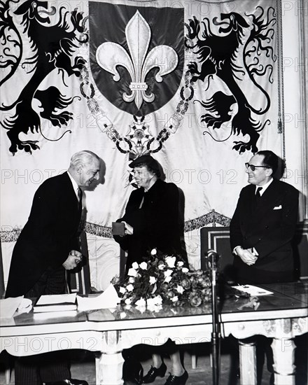 Photograph of Eleanor Roosevelt receiving a medal, and the title of "Citizen of Honour"