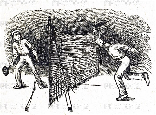 A friendly game of badminton between two young boys