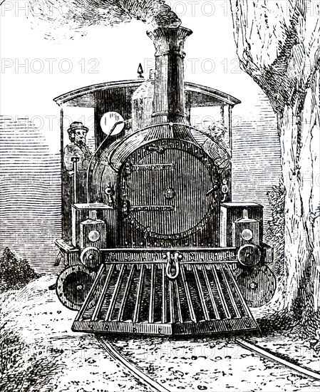 A locomotive driving through the countryside