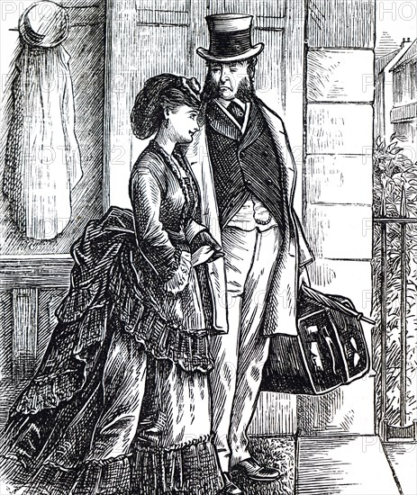 A father and daughter walking together toward the train station