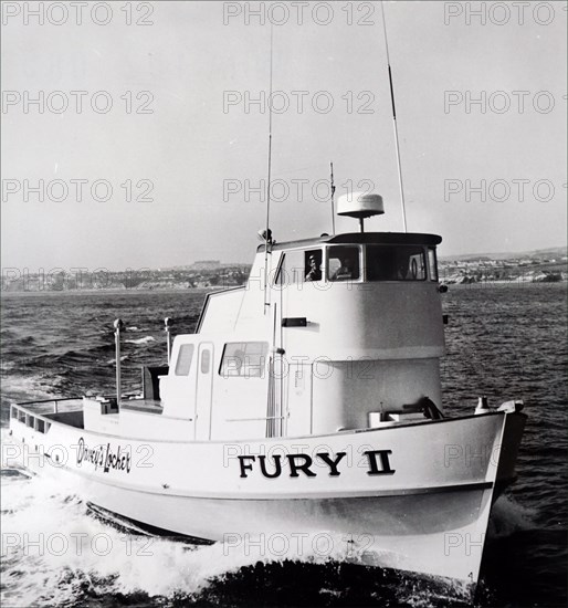 Photograph showing the antenna for the new Raytheon Radar, a weather-sealed 30-inch plastic dome shown here installed over pilot house of the Fury II of Newport Beach, California