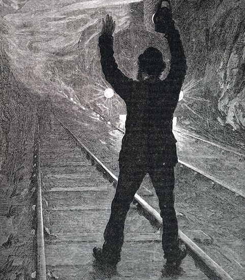 A man trying to stop a train during an emergency