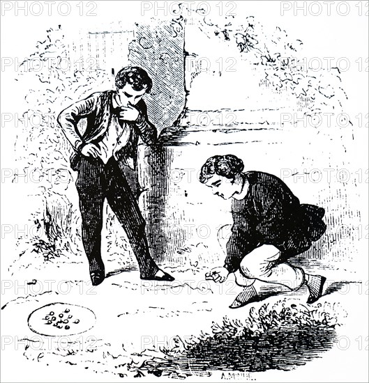 Boys playing marbles