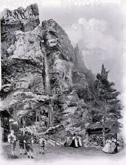 Photograph of a Swiss Village exhibit with waterfall.