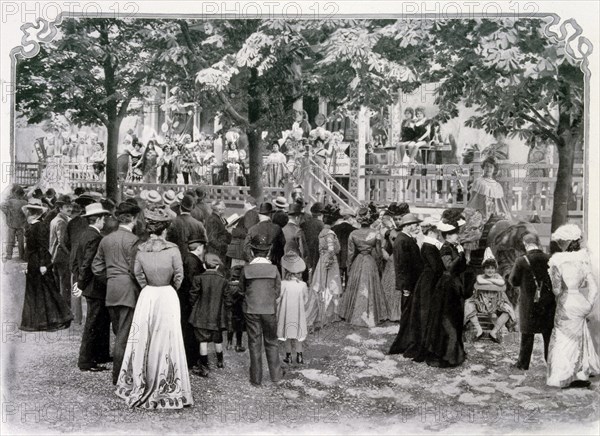 Photograph of a crowd watching a performance in La Rue de Paris entitled the Parade des Auteurs Gais.