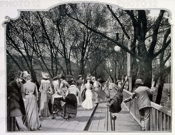 Photograph of the moving pavement, showing a woman falling off.