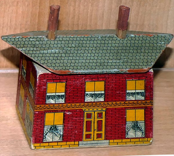 Painted wooden block in the form of a Dolls House. English circa 1900