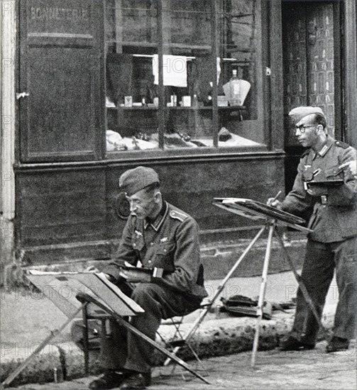 German soldiers painting in the deserted streets of Paris during World War II
