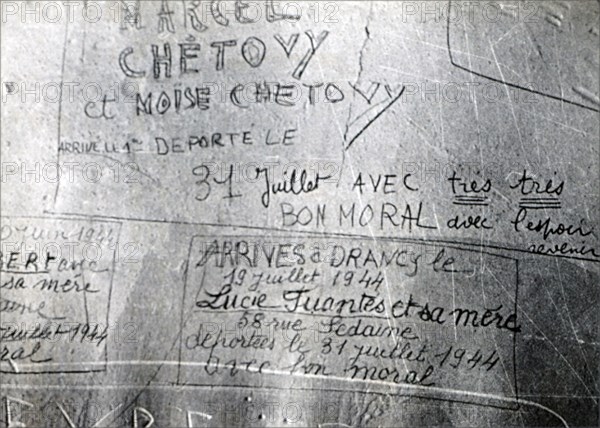 Messages of courage inscribed by Parisians on a wall before they were taken prisoner to Drancy internment camp by Germans during World War II