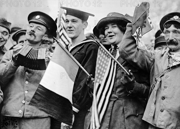 US and British soldiers, celebrating the armistice which marked the end of World War I on November 11th, 1918