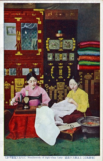 Korean seamstress making clothes for sale in her shop