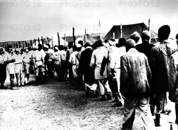 Arab prisoners in an Israeli camp. To the left, Israeli officers