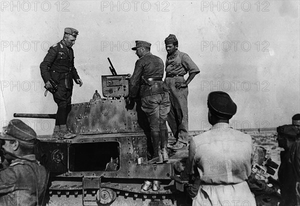 Rommel, Erwin 1891-1944
Officer, general field marshall, germany
commander of the german africa corps Feb.41-March 43 (WWII) 
Lt. gen. Rommel observing from top of an italian tank (carro armato M13/40) enemy troop movements at Sollum (british op.Brevity)