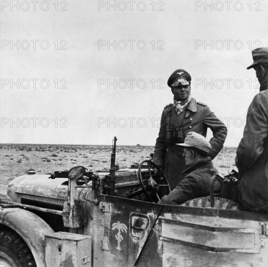 Rommel, Erwin 1891-1944
Officer, general field marshall, germany
commander of the german africa corps Feb.41-March 43 (WWII) - General of the Panzertruppe Rommel in his command post vehicle with the 15. armoured division between Tobruk and Sidi Omar. Novem