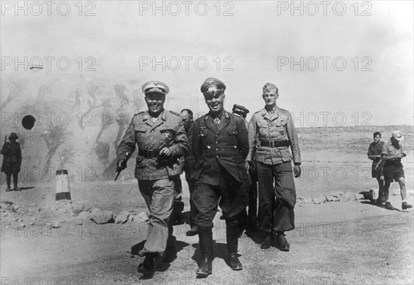Rommel, Erwin 1891-1944
Officer, general field marshall, germany
commander of the german africa corps Feb.41-March 43 (WWII) 
Rommel (C) togehter with general field marshall Albert Kesselring (C-in-C South) at El Alamein - front. 
about 01.July 1942