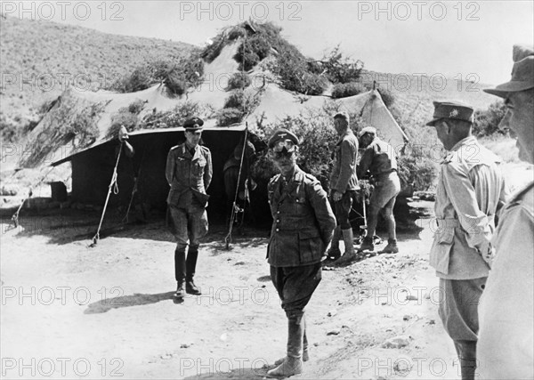 Rommel, Erwin 1891-1944
officer (gen.field marshall), gemany
commander of afrikacorps feb1941-march43
Col.Gen. Rommel in 2.WW in northafrica (cyrenaika) during the offensice direction Ghazala - at a visit to the italian gen. Navarini's HQ.
May/June 1942