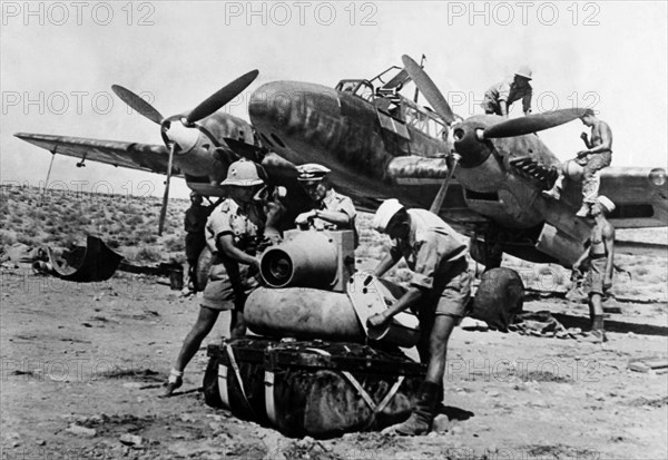 2.WW, Northafrica, war theater (Africa campaign) , german Luftwaffe Feb.41-May43:
Rommel's first offensive - combat zone Tobruk - a reconnaissance-camera is installed to a Me-110 fighter plane 
on a desert airfield. 
May 1941