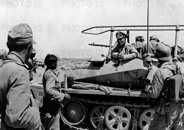 Rommel, Erwin 1891-1944
Officer, general field marshall, germany
commander of the german africa corps Feb.41-March 43 (WWII) 
Col.Gen. Rommel in his armoured command post vehicle ahaed of Tobruk (taken on June 21st) 
about 19./20.June 1942