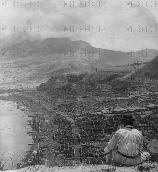 French overseas department Martinique, view from Orange Hill over dead Saint-Pierre, to steaming Mount Pelee after strongest volcanic eruption of Mount Pelee, 8 May 1902