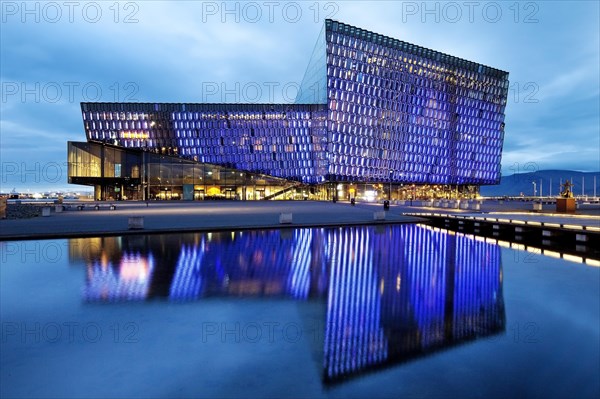 Illuminated Harpa Concert Hall at dusk